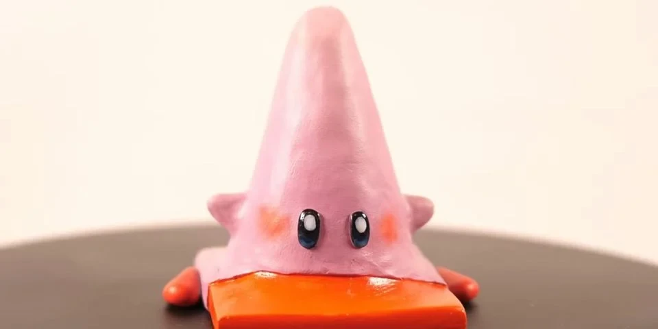 Художник создает глиняные фигурки Кирби, поедающего различные предметы в режиме "Полный рот"